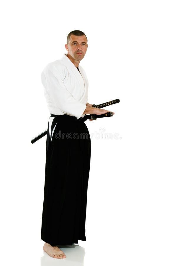 Man demonstrating martial arts isolated over white background. Man demonstrating martial arts isolated over white background