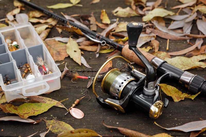 Fishing tackle on wooden weathered surface. Fishing tackle on wooden weathered surface.