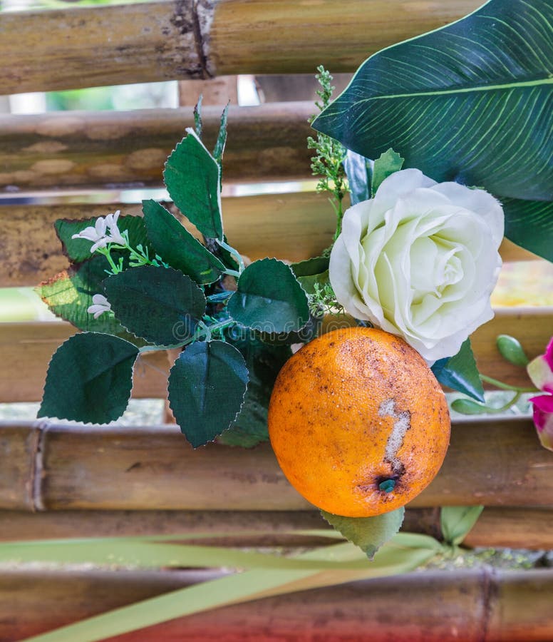 Artificial Flower is White Rose and Orange is Element. Stock Image