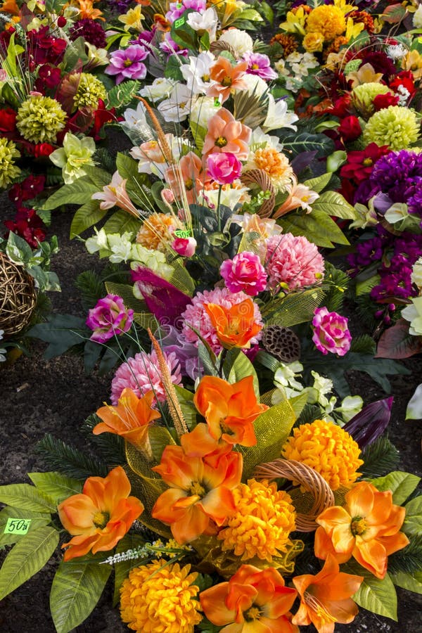 Bouquet of Flowers Sticking Out from a Trash Container Stock Image