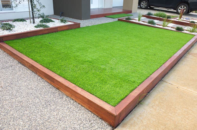 Artificial grass/lawn turf in the front yard of a modern home/residential house royalty free stock photo