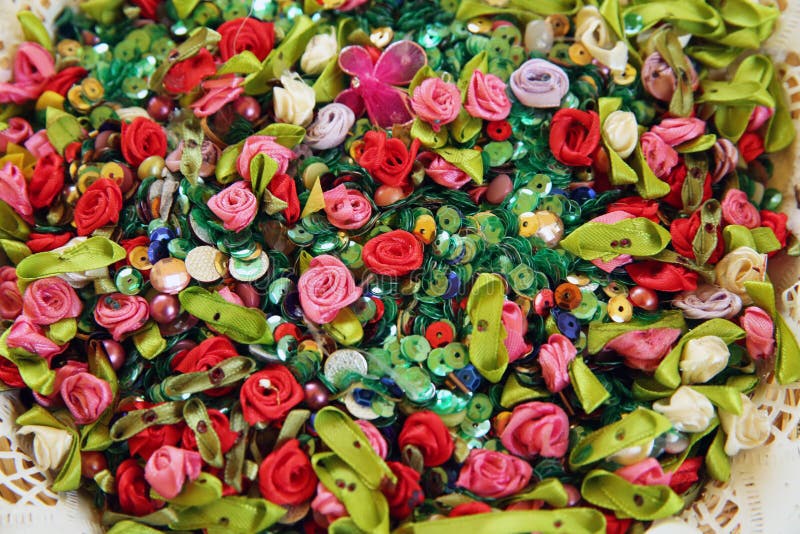 Artificial multicolored flowers. Beautiful multicolored artificial flowers background. flowers decor. Artificial beads and flower royalty free stock images