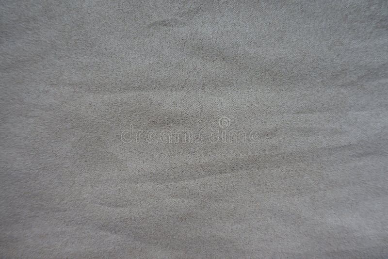 Artificial suede fabric in dull shade of grey stock photo