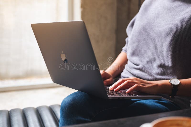 Mar 11th 2021 : A woman using and working on Apple MacBook Pro laptop computer, Chiang mai Thailand. Mar 11th 2021 : A woman using and working on Apple MacBook Pro laptop computer, Chiang mai Thailand