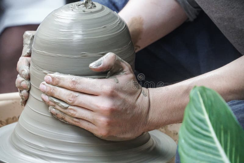 Artisan hands making clay pot handmade pottery workshop