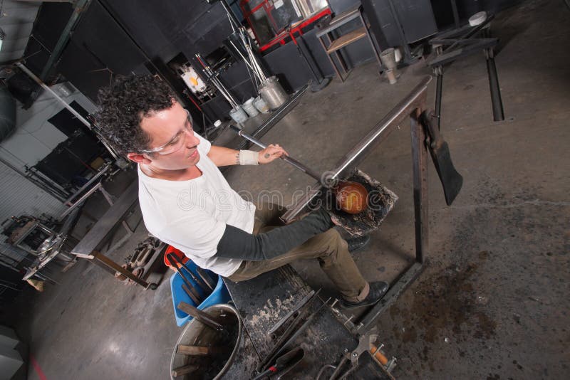 Artisan Handling Hot Glass stock image. Image of object 31244777
