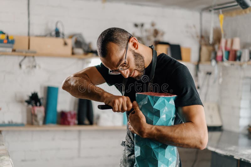Artisan Sculptor Artist Creates a Work of Art in His Stock Photo Image of clothing