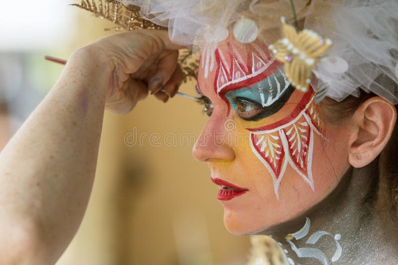 Artist Applies Body Paint To Female Model's Face stock images Artist Applies Body Paint To Female Model's Face stock images