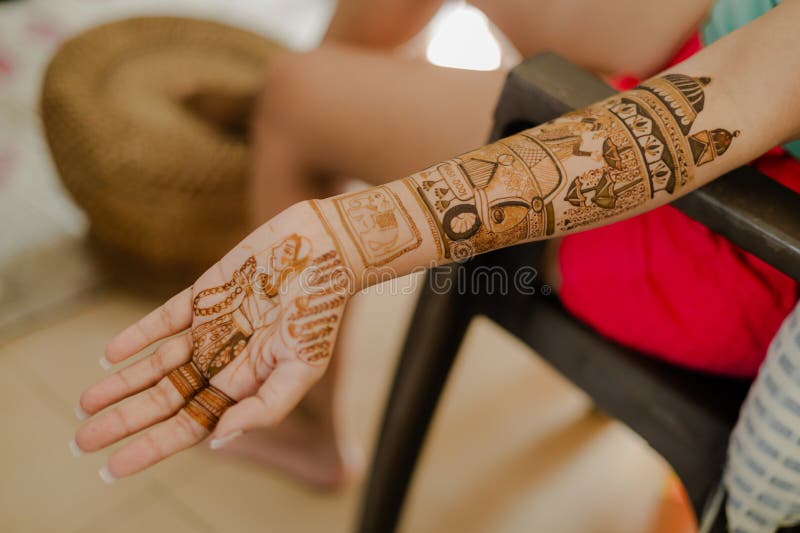 Caucasian woman with Indian henna tattoos on her hands stock photo - OFFSET