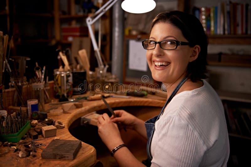 My kind of therapy. An artist creating something out of wood. royalty free stock photo