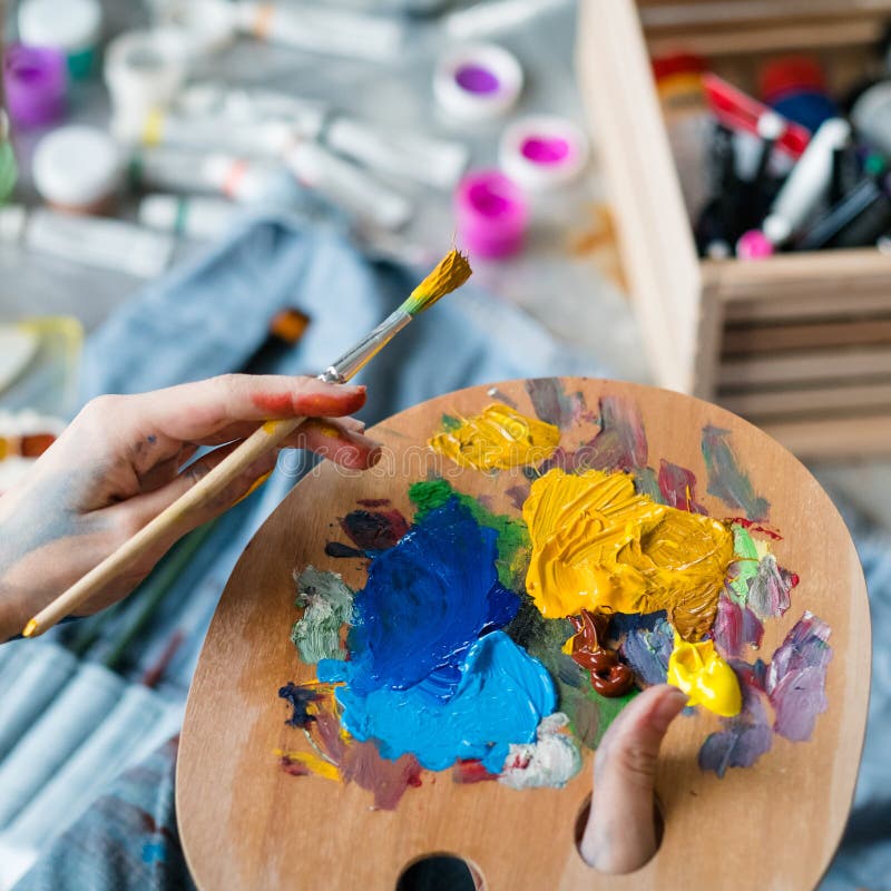 Artist essential tools wooden palette paintbrush stock photo Artist essential tools wooden palette paintbrush stock photo