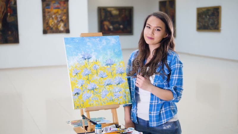 Artist portrait. Talented beautiful painter in art studio..