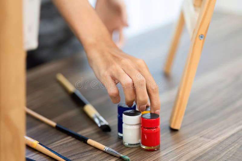 Artistic Expression through Painting: Adult and Child Using Paints royalty free stock photos