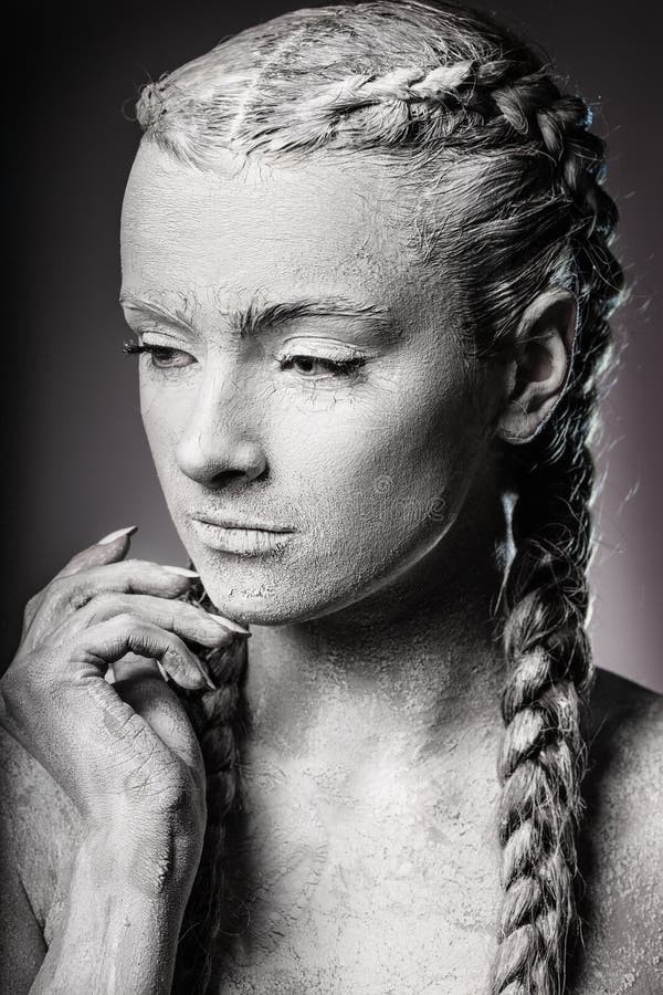 Artistic portrait of a woman covered in cracked white paint. royalty free stock photos Artistic portrait of a woman covered in cracked white paint. royalty free stock photos