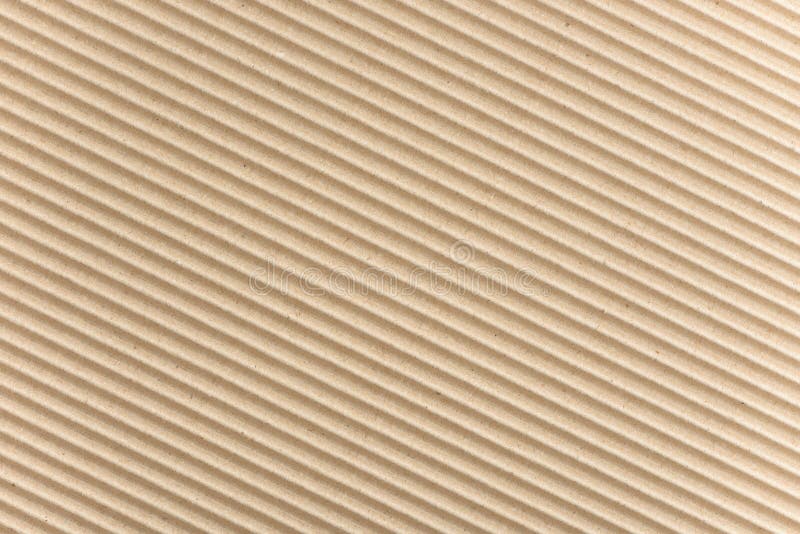 Carton or cardboard packing material. Texture of corrugated paper sheets made from cellulose. Supplies for creating boxes.