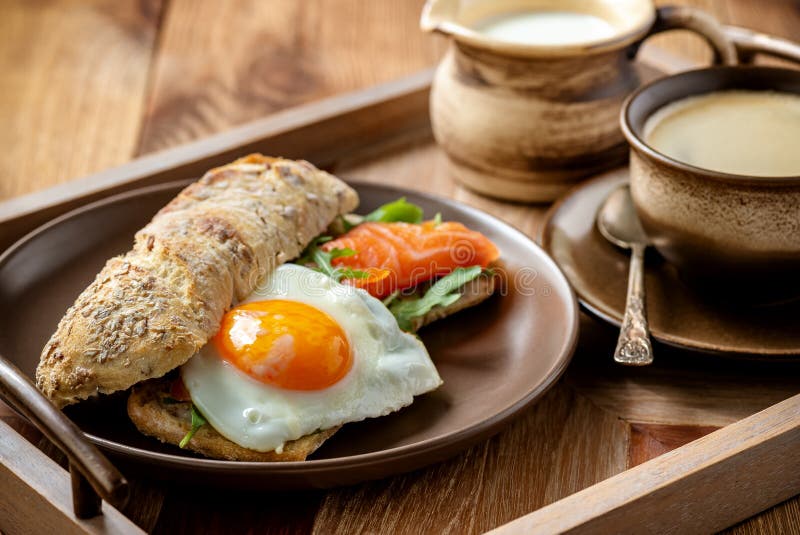 Arugula, Salmon and Runny Egg Sandwich, Homemade Breakfast. Stock Image
