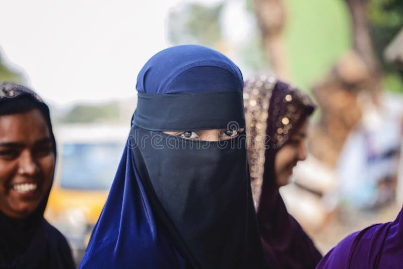 Young girl wearing burka clothes according to her religion stock photography Young girl wearing burka clothes according to her religion stock photography