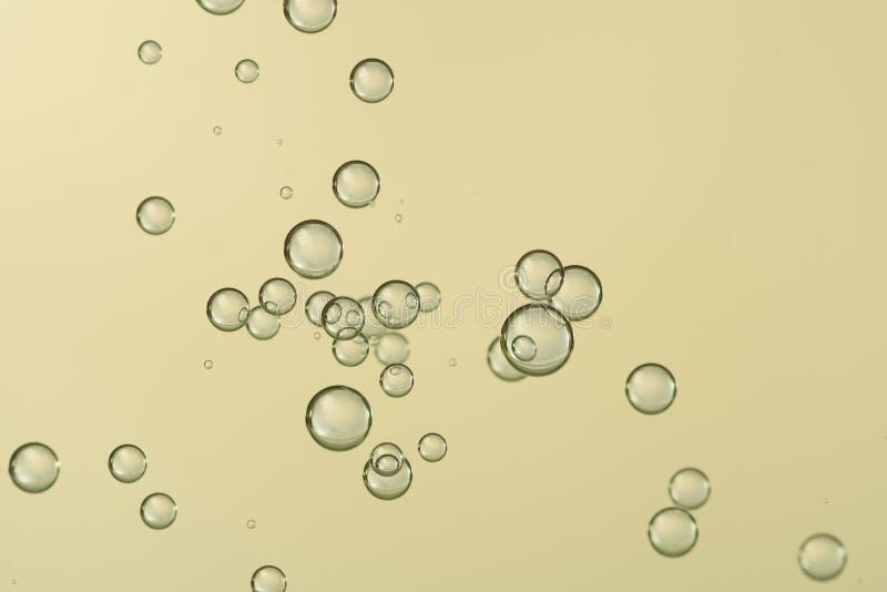 Champagne bubbles flows over a golden background. Champagne bubbles flows over a golden background