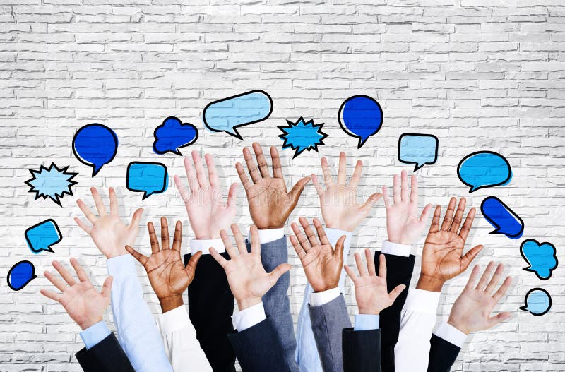 Business People's Hands Raised with Speech Bubble by Brick Wall. Business People's Hands Raised with Speech Bubble by Brick Wall