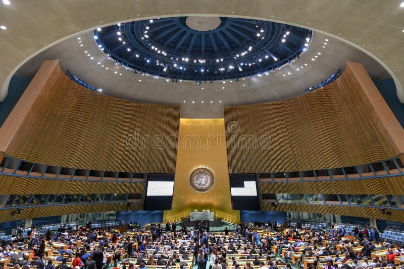 New York City - February 14, 2018: United Nations General Assembly Hall in Manhattan, New York City. The General Assembly Hall is the largest room in the UN with seating capacity over 1,800 people. New York City - February 14, 2018: United Nations General Assembly Hall in Manhattan, New York City. The General Assembly Hall is the largest room in the UN with seating capacity over 1,800 people.