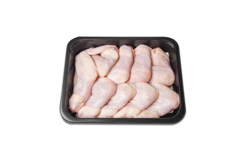 Asas de galinha em um recipiente plástico Carne das aves dom?sticas na bandeja, isolada no fundo branco Vista superior Asas de ga fotos de stock royalty free Asas de galinha em um recipiente plástico Carne das aves dom?sticas na bandeja, isolada no fundo branco Vista superior Asas de ga fotos de stock royalty free