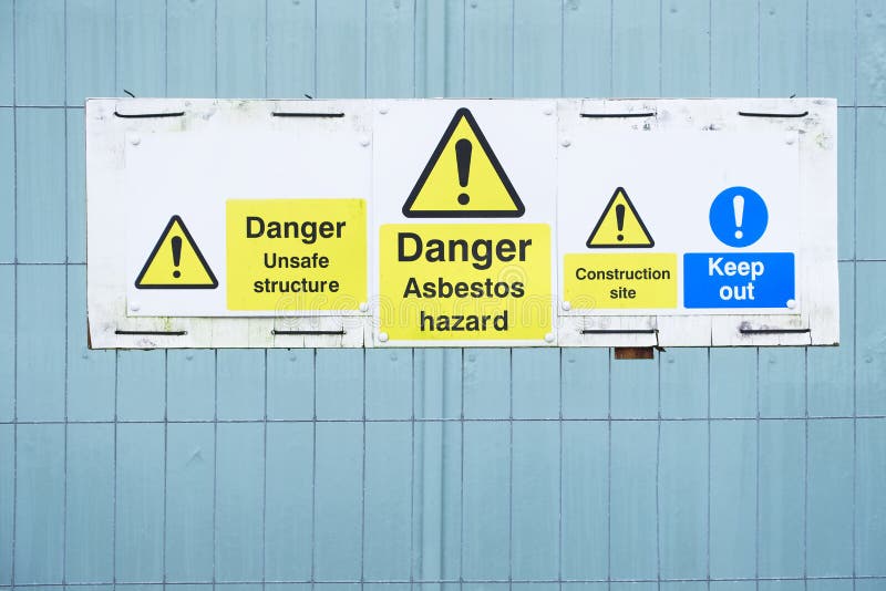 Asbestos hazard danger sign at construction site keep out