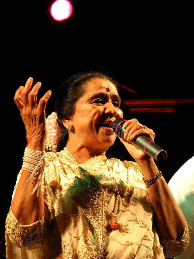 The legendary Indian singer Asha Bhosale in a performance. She is one of the most versatile singers and holds a record for having recording highest number of songs in the world. Respectable number stock images, royalty-free photos and pictures