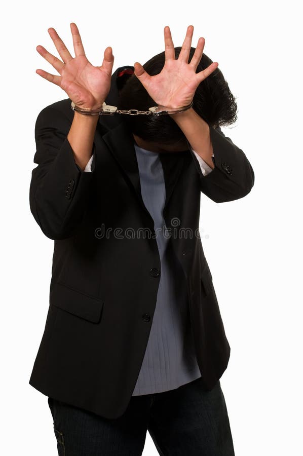 Ashamed man in handcuffs royalty free stock photography
