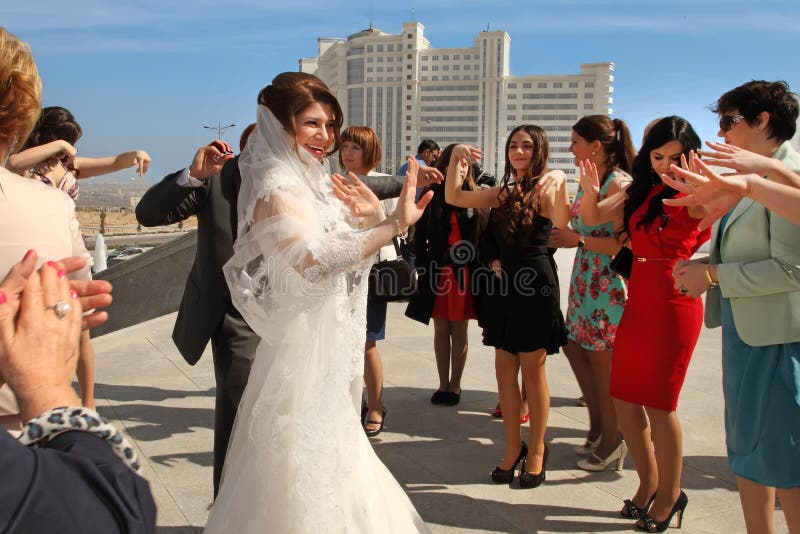 Ashgabad, Turkmenistan - May 15, 2013. The bride and groom danci stock photo Ashgabad, Turkmenistan - May 15, 2013. The bride and groom danci stock photo