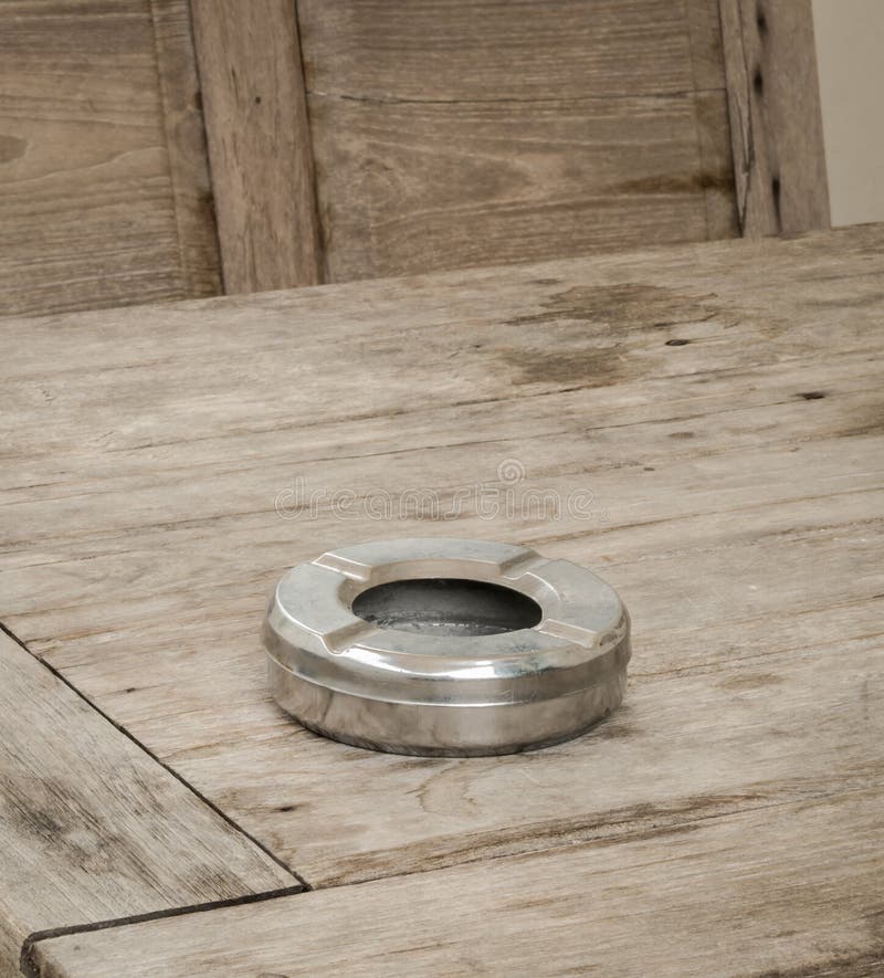 Ashtray on a wooden table stock photo. Image of healthcare 55380090