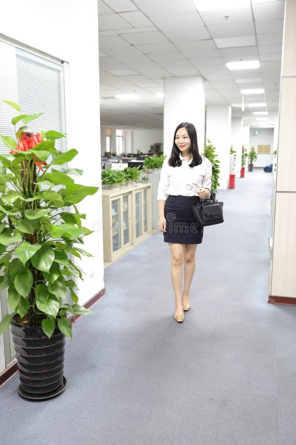 Asia Chinese office lady woman girl walk in office at work smile wear business occupation suit workplace