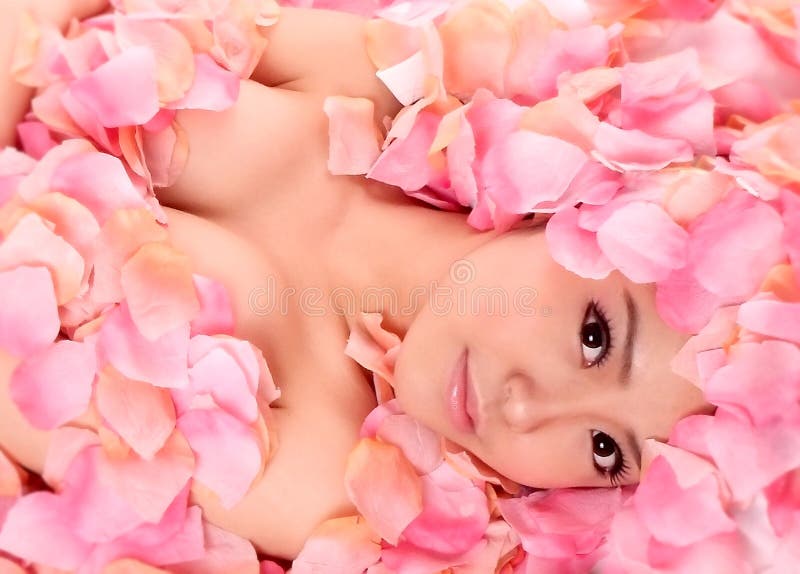 An asia girl in pink flowers. An asia girl in pink flowers