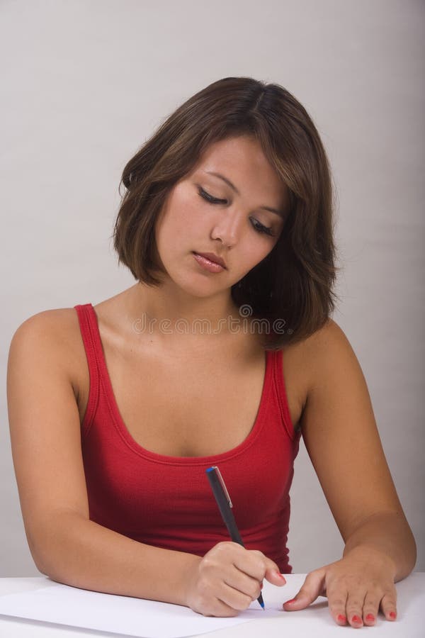 Asian-American woman writing a letter