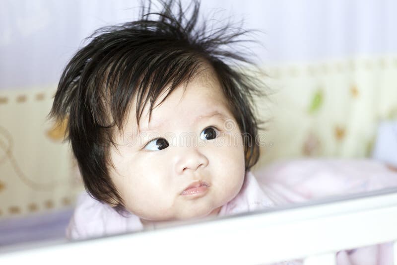 Asian baby girl at home