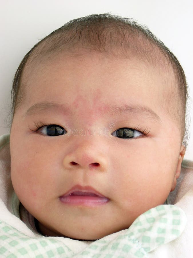 Asian baby portrait gently smiling