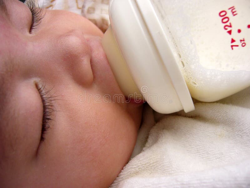 Asian baby sleeping milk feeding,nipple in mouth