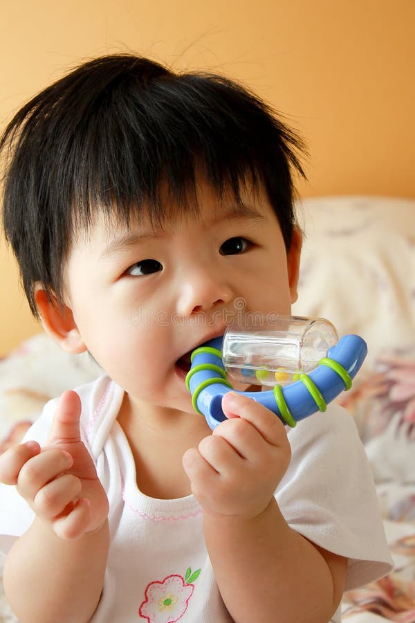 Asian Baby with Toy stock photo. Image of little, asian 9277224