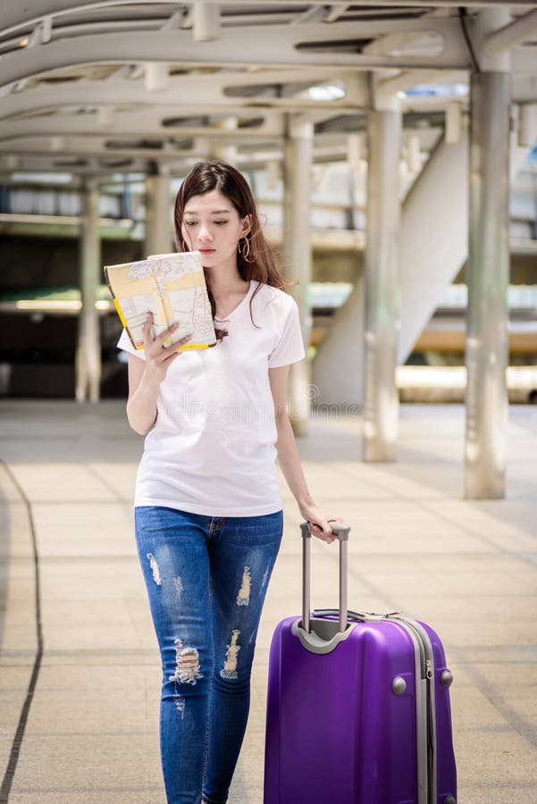 Asian beautiful woman tourist walking and travel with big purple royalty free stock image Asian beautiful woman tourist walking and travel with big purple royalty free stock image