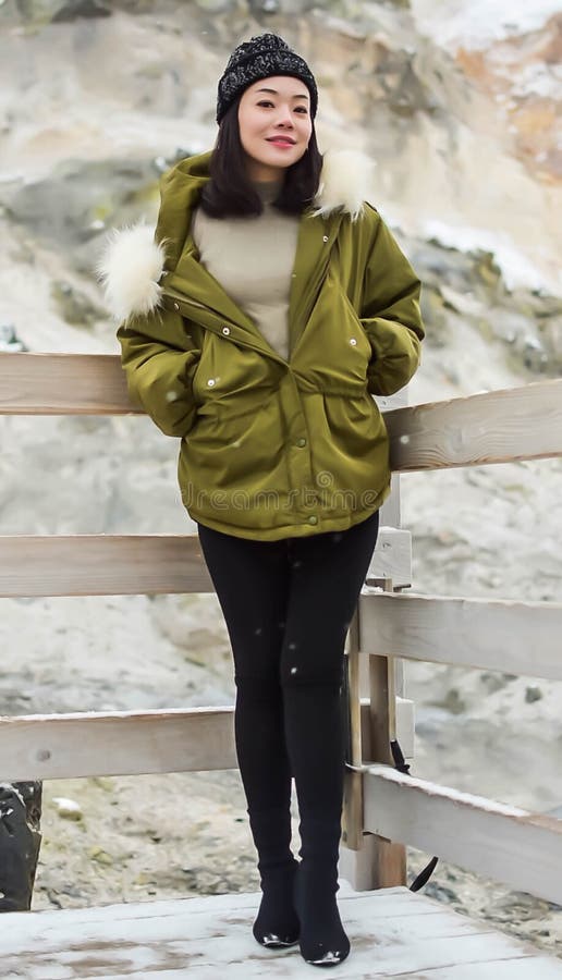 An asian beautiful woman wearing green coat and wool hat royalty free stock photo An asian beautiful woman wearing green coat and wool hat royalty free stock photo