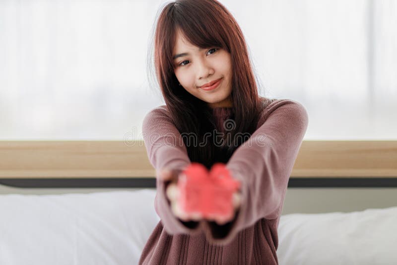 Asian Mom Delivers Red Gift Box Stock Photo 1236607957