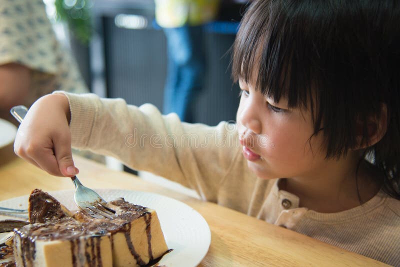 Asian boy eating honey toast