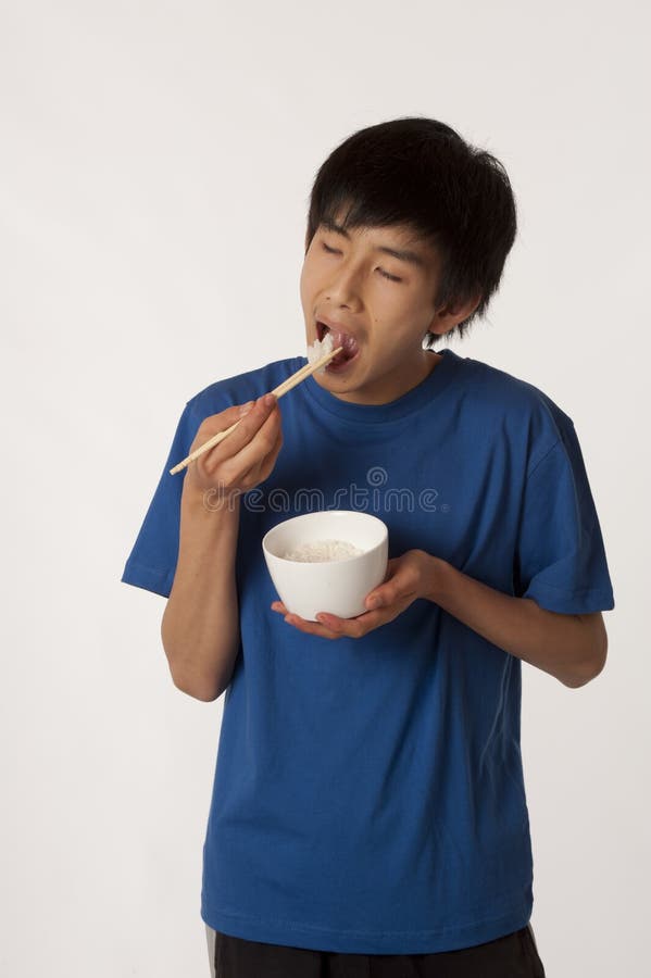 Asian Boy Eating Rice With Chopsticks Stock Image Image of asian