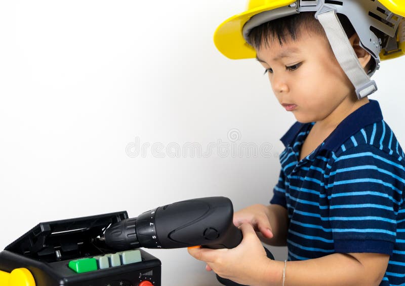 Asian Boy is Fixing Cassette Tape Player. Stock Photo Image of child
