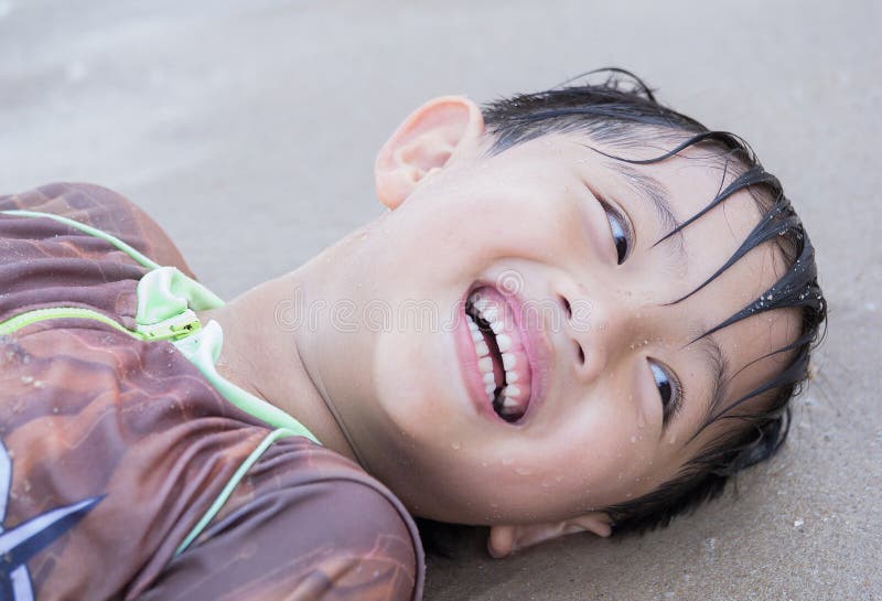 Asian beach happy swim suit boy sea kid playing fun. Asian beach happy swim suit boy sea kid playing fun