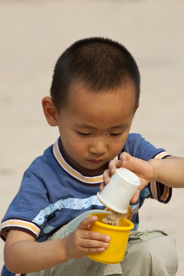 Asian boy playing