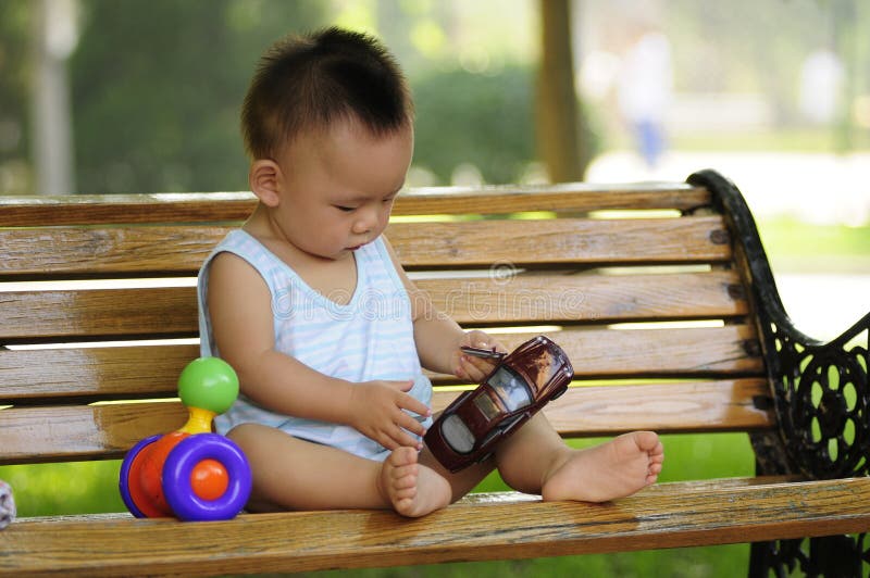 Asian boy playing toy