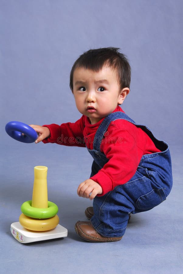 Asian boy playing toy