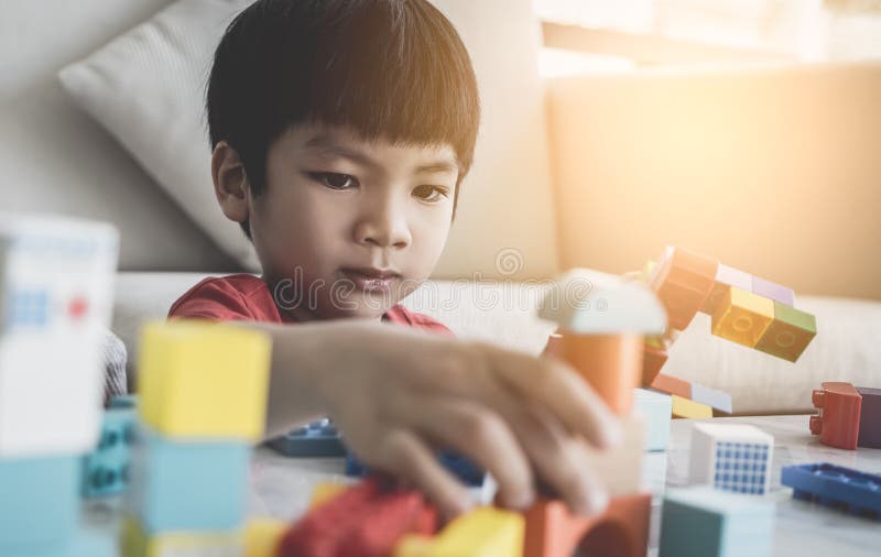Boy Stacking Toy Blocks on a Living Room Table Stock Photo Image of