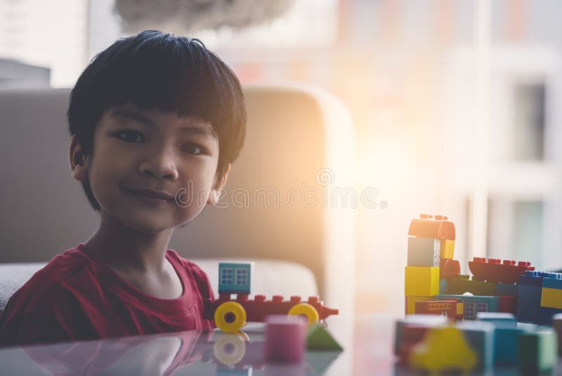 Boy Stacking Toy Blocks on a Living Room Table Stock Image - Image of ...