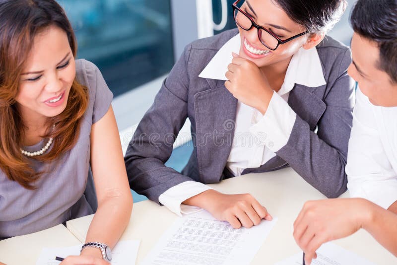 Asian business team brainstorming royalty free stock photos Asian business team brainstorming royalty free stock photos